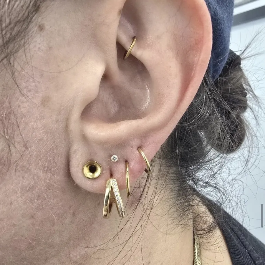 Gold lobe stack with a daith ring