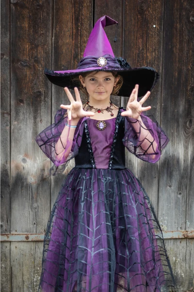 Child wearing Amethyst the Spider Witch Dress with Hat